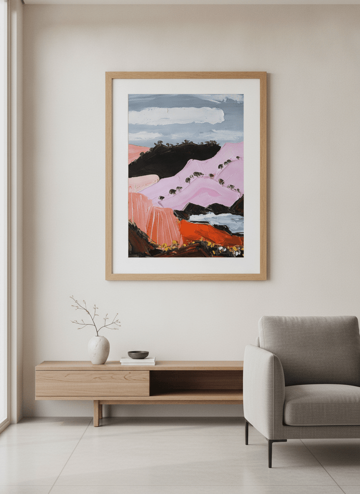 Modern wall art styled above a sofa in a neutral living room