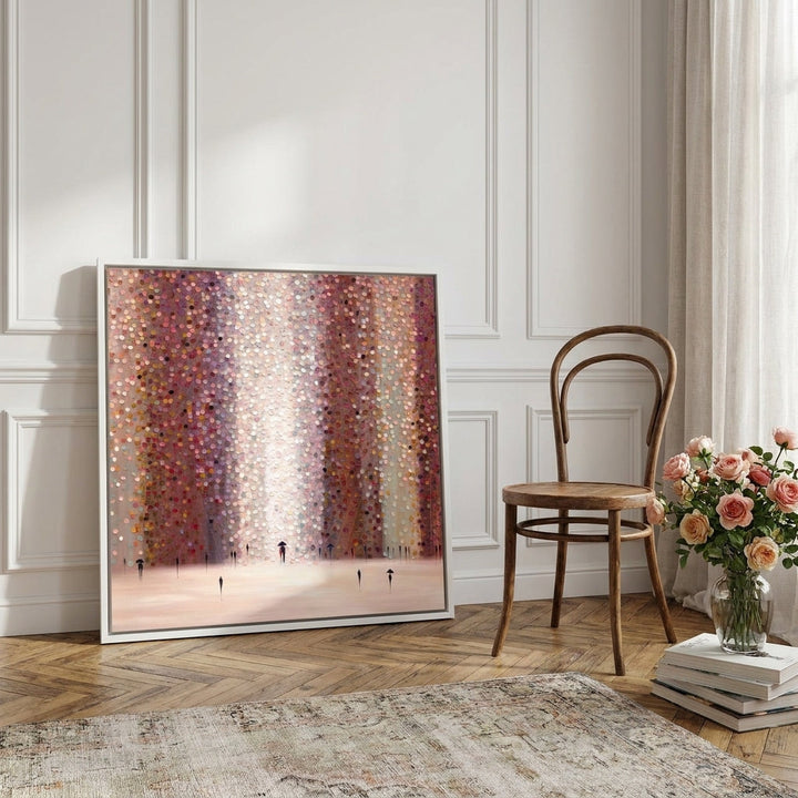 Canvas wall art with a white surround leaning against the wall in a Parisian dining room