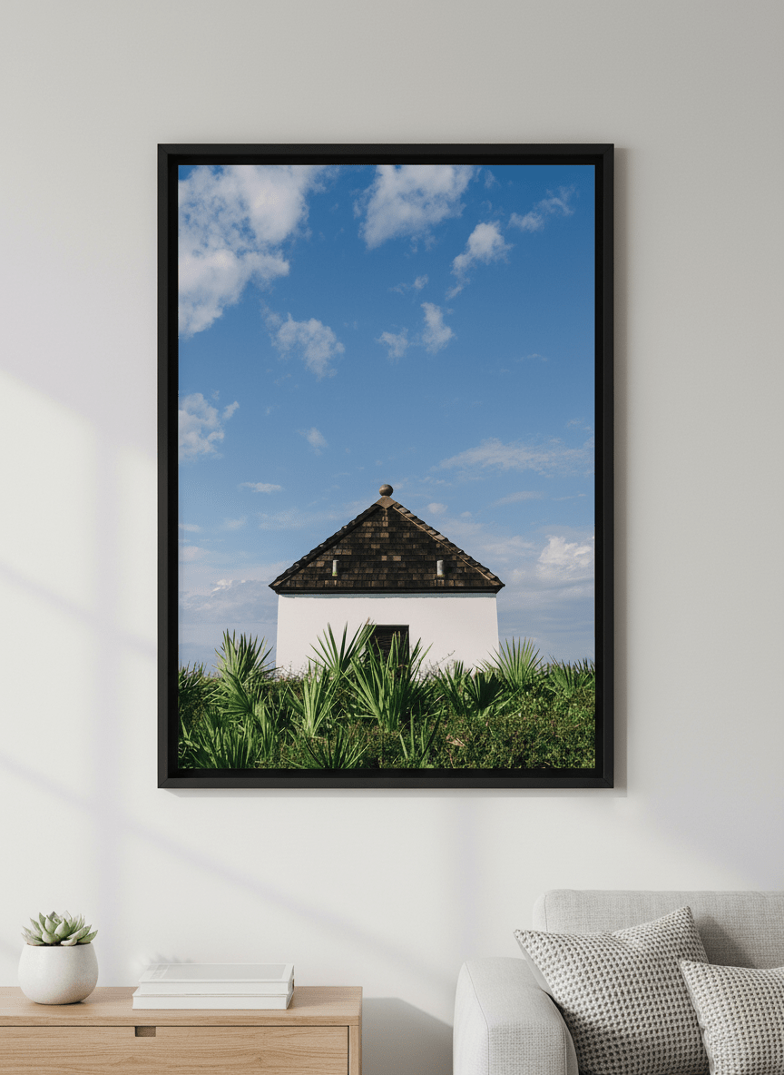 Modern wall art styled above a sofa in a neutral living room