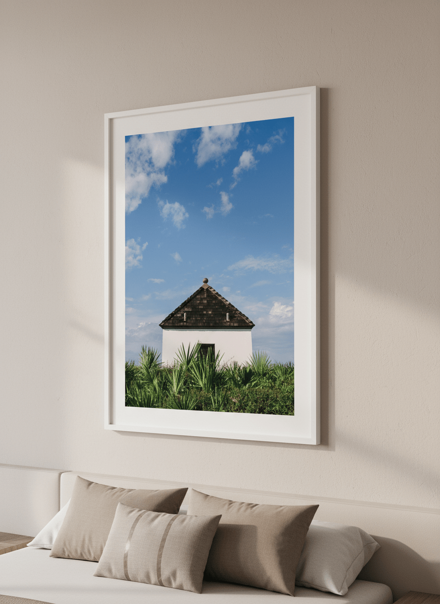 Minimalist artwork displayed in a calm, light-filled bedroom interior