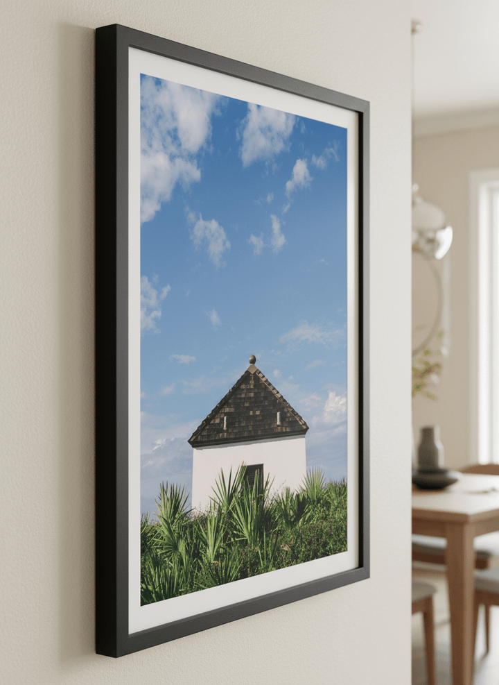 Wall art styled above a dining table in a contemporary home