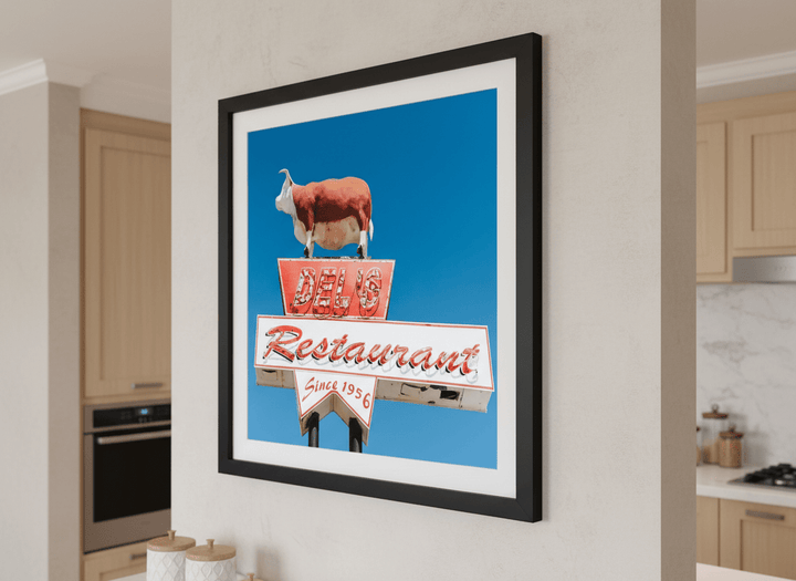 Artwork styled on the wall of a bright modern kitchen
