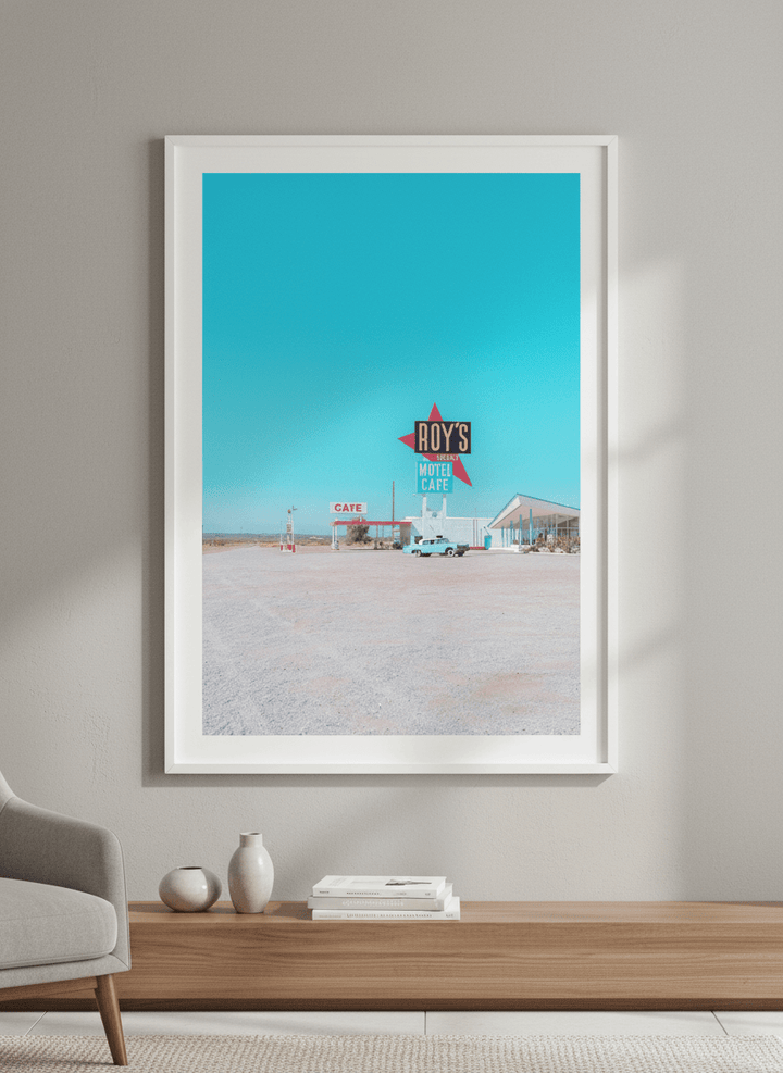 Modern wall art styled above a sofa in a neutral living room