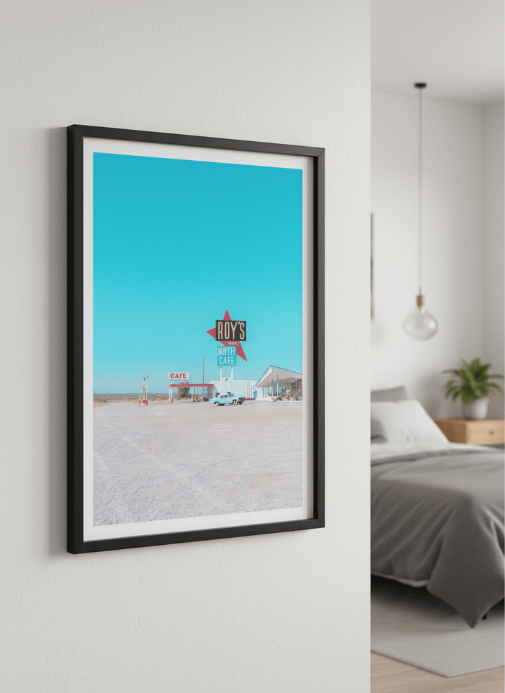Minimalist artwork displayed in a calm, light-filled bedroom interior