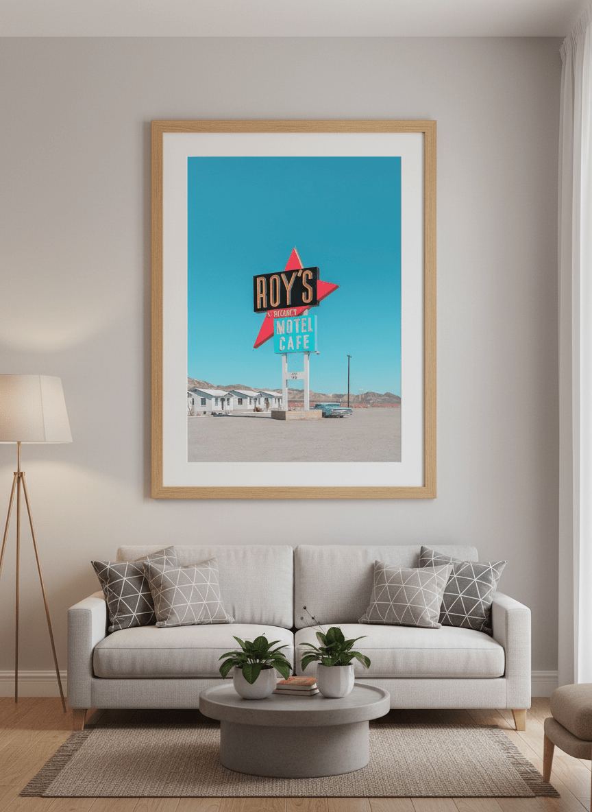 Modern wall art styled above a sofa in a neutral living room