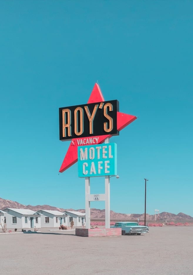 Roy's Motel Cafe Sign By Tom Windeknecht