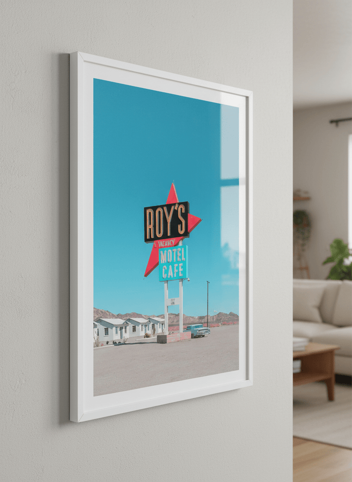 Modern wall art styled above a sofa in a neutral living room