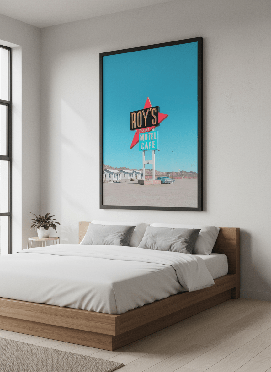 Minimalist artwork displayed in a calm, light-filled bedroom interior