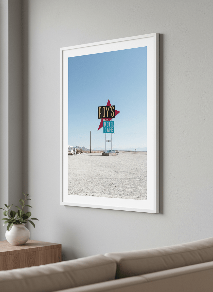 Modern wall art styled above a sofa in a neutral living room