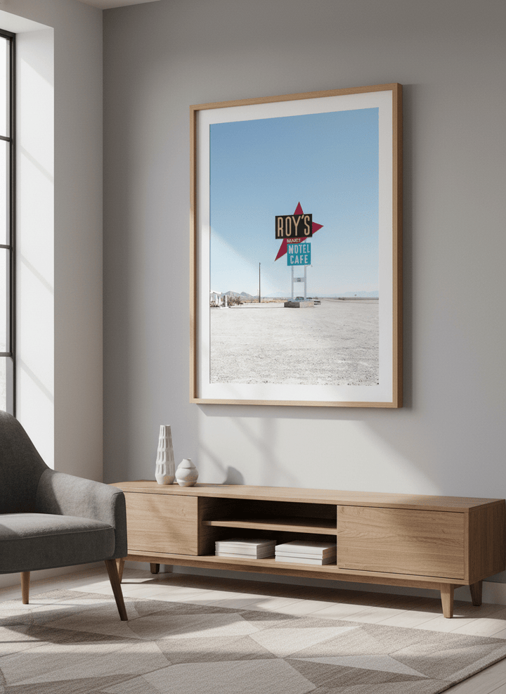 Modern wall art styled above a sofa in a neutral living room