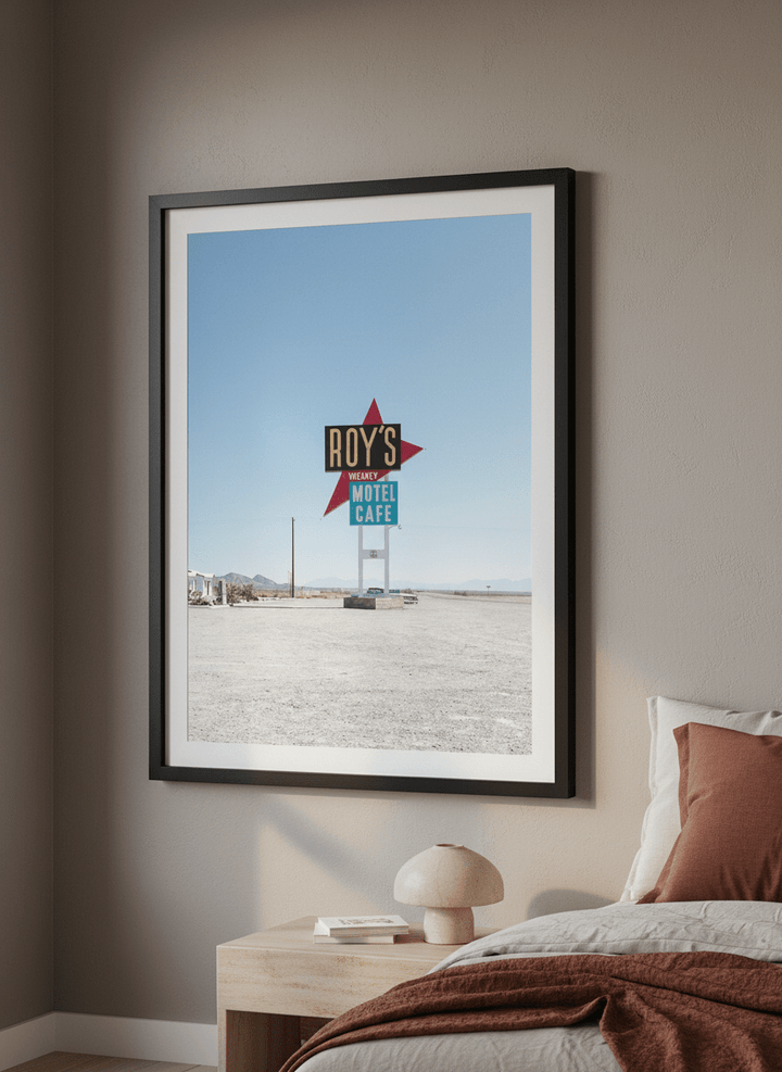 Minimalist artwork displayed in a calm, light-filled bedroom interior