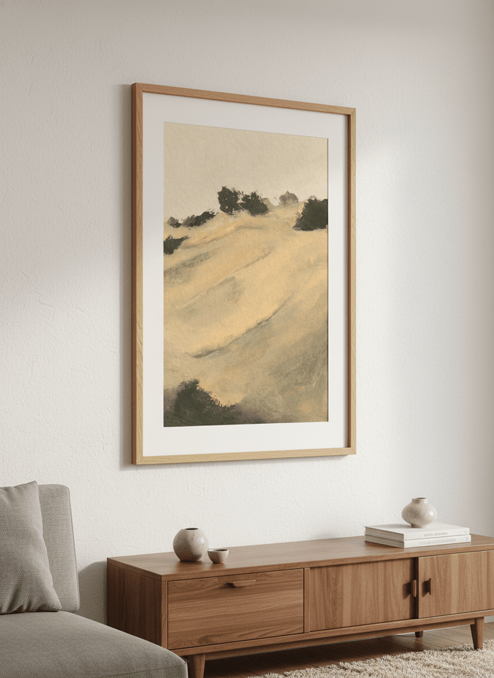 Modern wall art styled above a sofa in a neutral living room