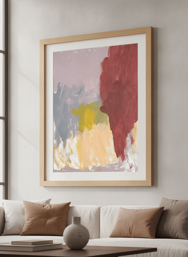 Modern wall art styled above a sofa in a neutral living room