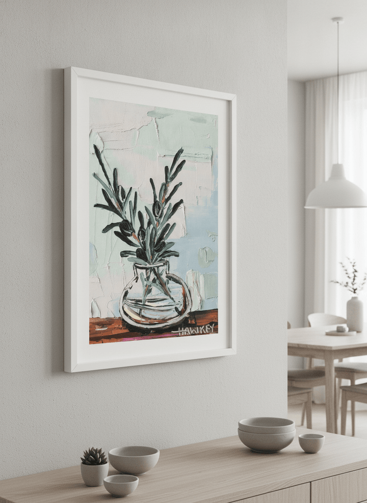 Wall art styled above a dining table in a contemporary home
