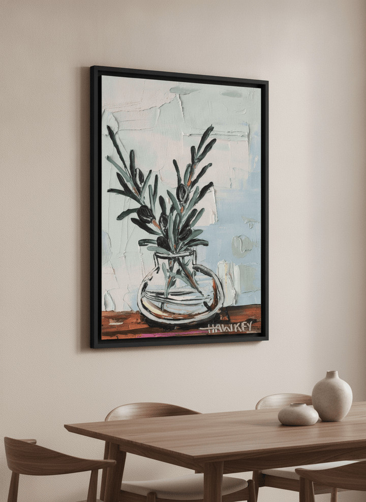 Wall art styled above a dining table in a contemporary home