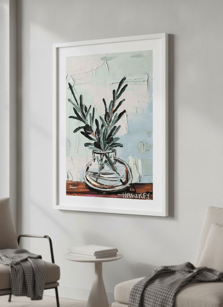 Modern wall art styled above a sofa in a neutral living room