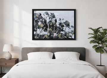 Minimalist artwork displayed in a calm, light-filled bedroom interior