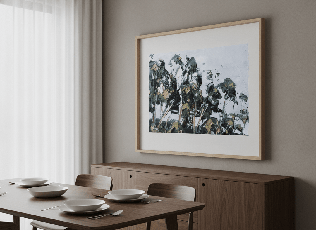 Wall art styled above a dining table in a contemporary home