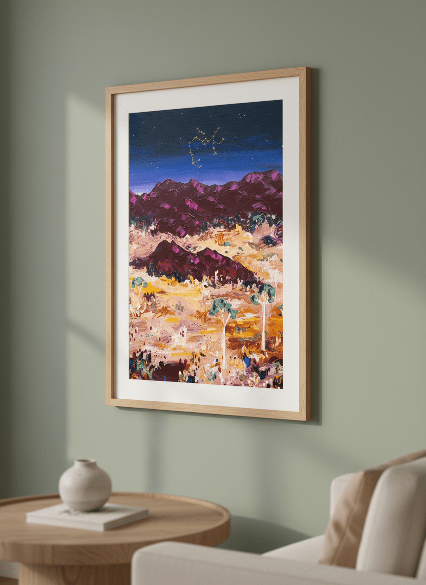 Modern wall art styled above a sofa in a neutral living room