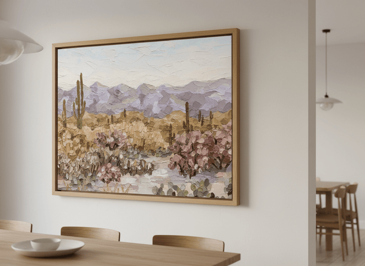 Wall art styled above a dining table in a contemporary home