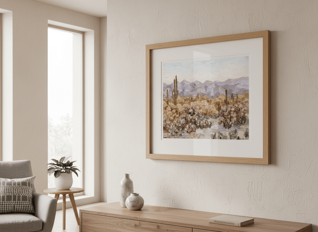 Modern wall art styled above a sofa in a neutral living room