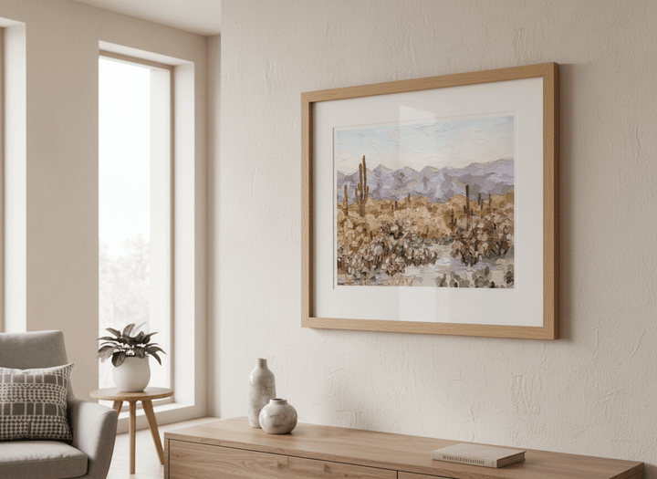 Modern wall art styled above a sofa in a neutral living room