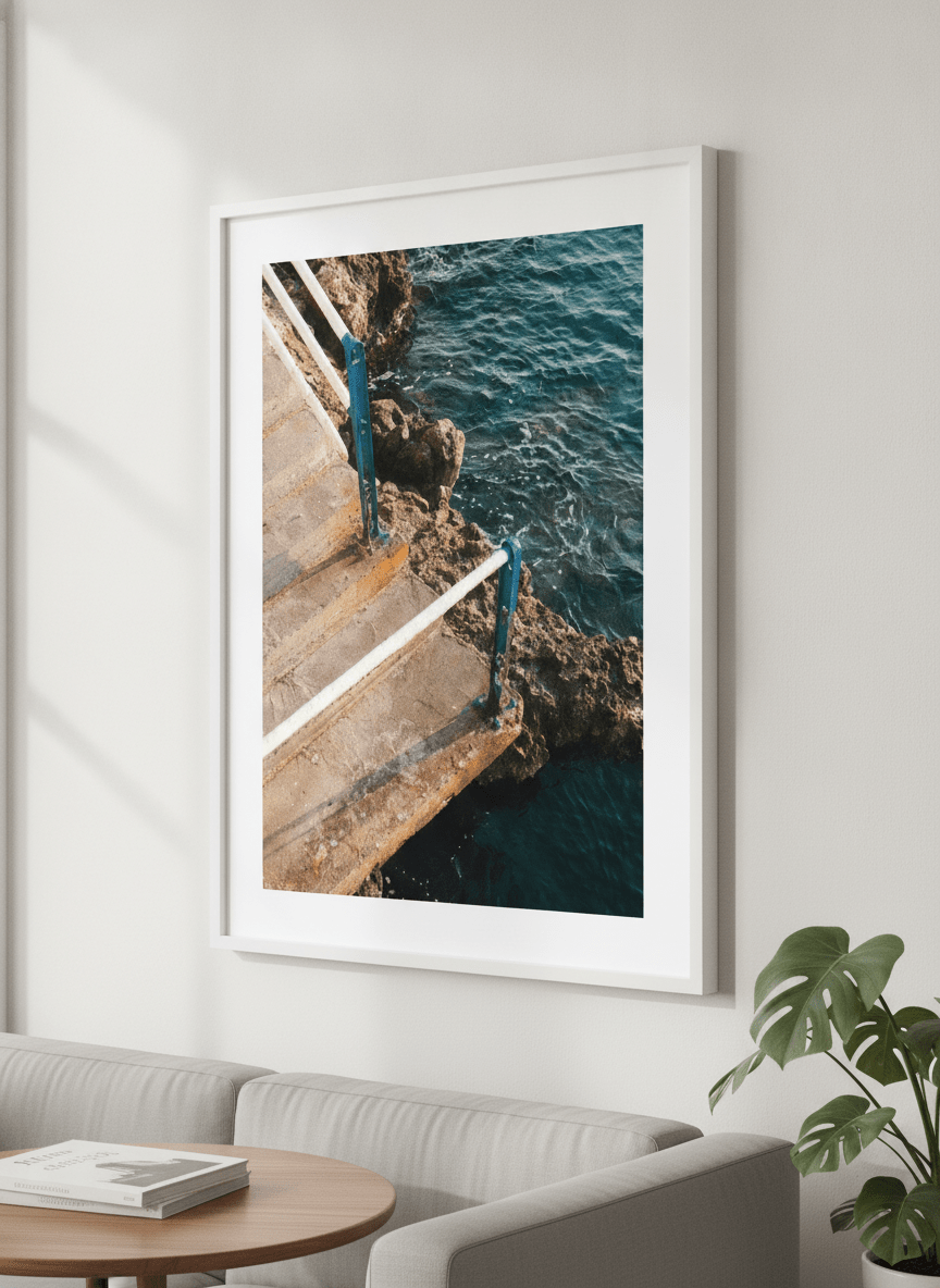 Modern wall art styled above a sofa in a neutral living room