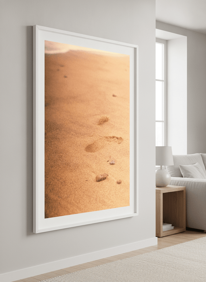 Modern wall art styled above a sofa in a neutral living room