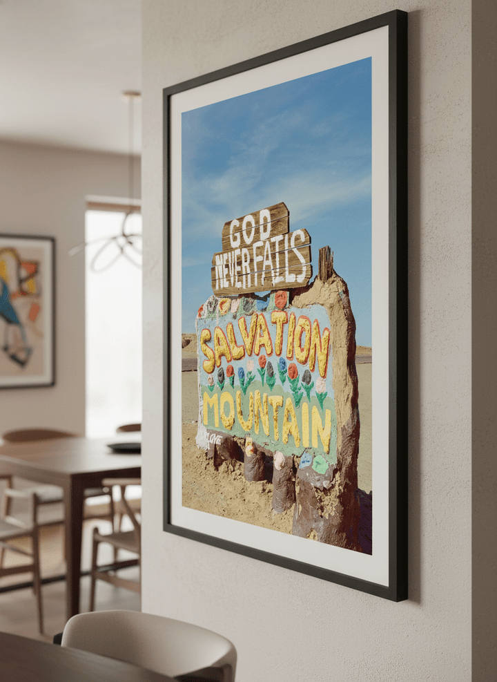 Wall art styled above a dining table in a contemporary home