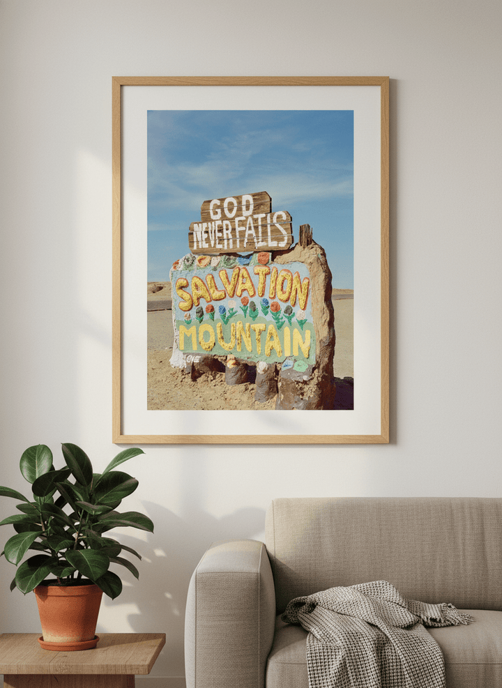 Modern wall art styled above a sofa in a neutral living room