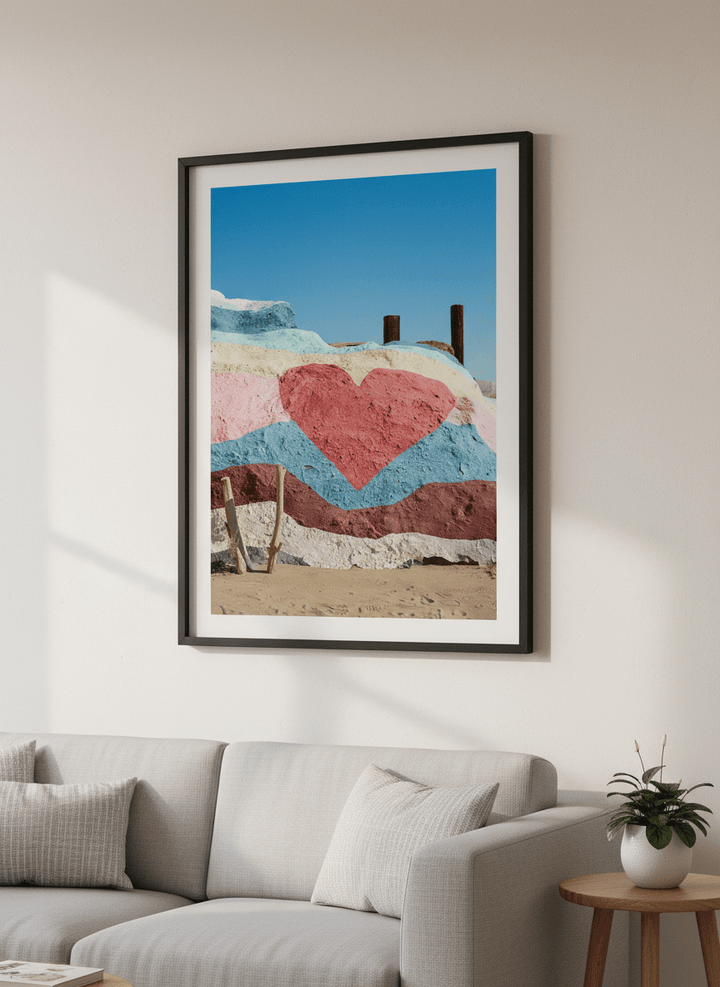 Modern wall art styled above a sofa in a neutral living room