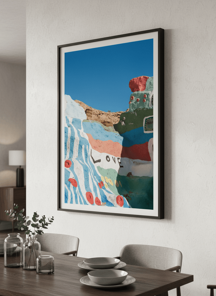 Wall art styled above a dining table in a contemporary home