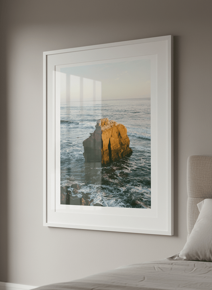 Minimalist artwork displayed in a calm, light-filled bedroom interior