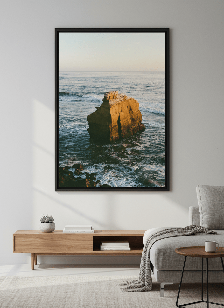 Modern wall art styled above a sofa in a neutral living room