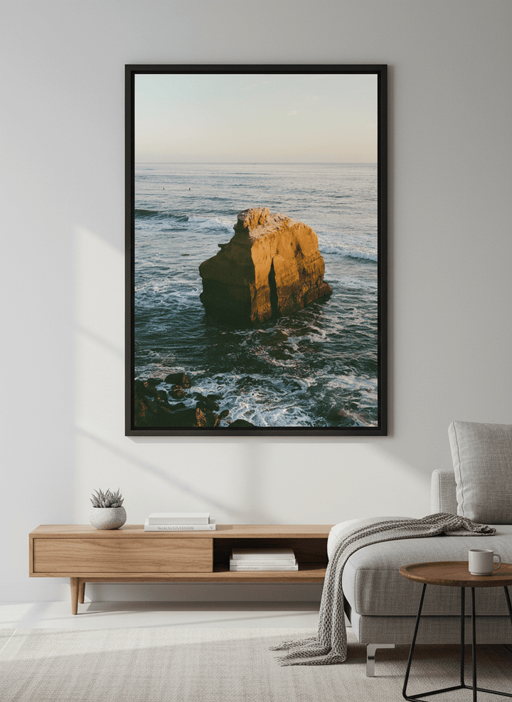 Modern wall art styled above a sofa in a neutral living room