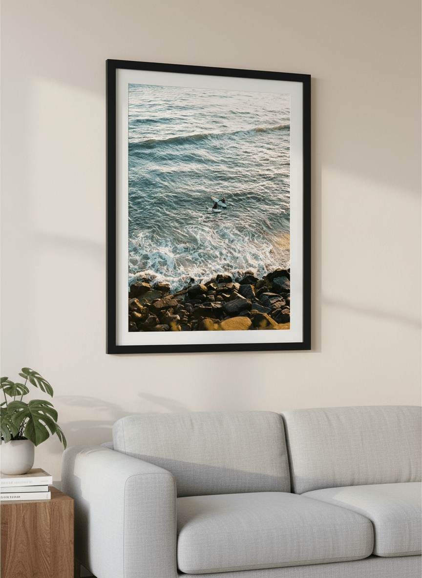 Modern wall art styled above a sofa in a neutral living room
