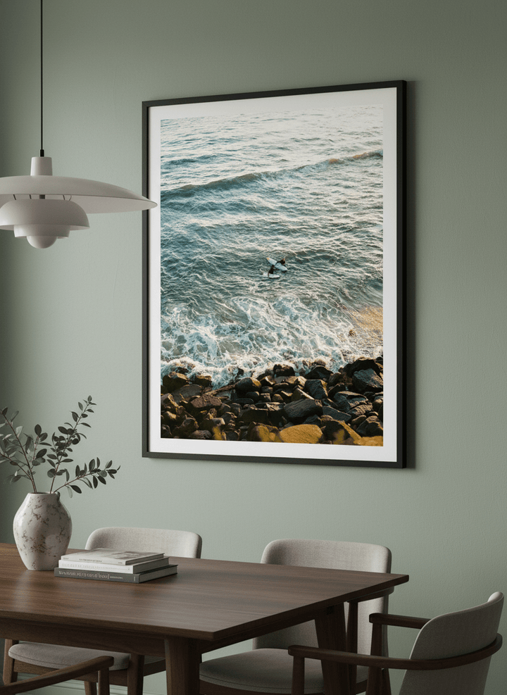 Wall art styled above a dining table in a contemporary home