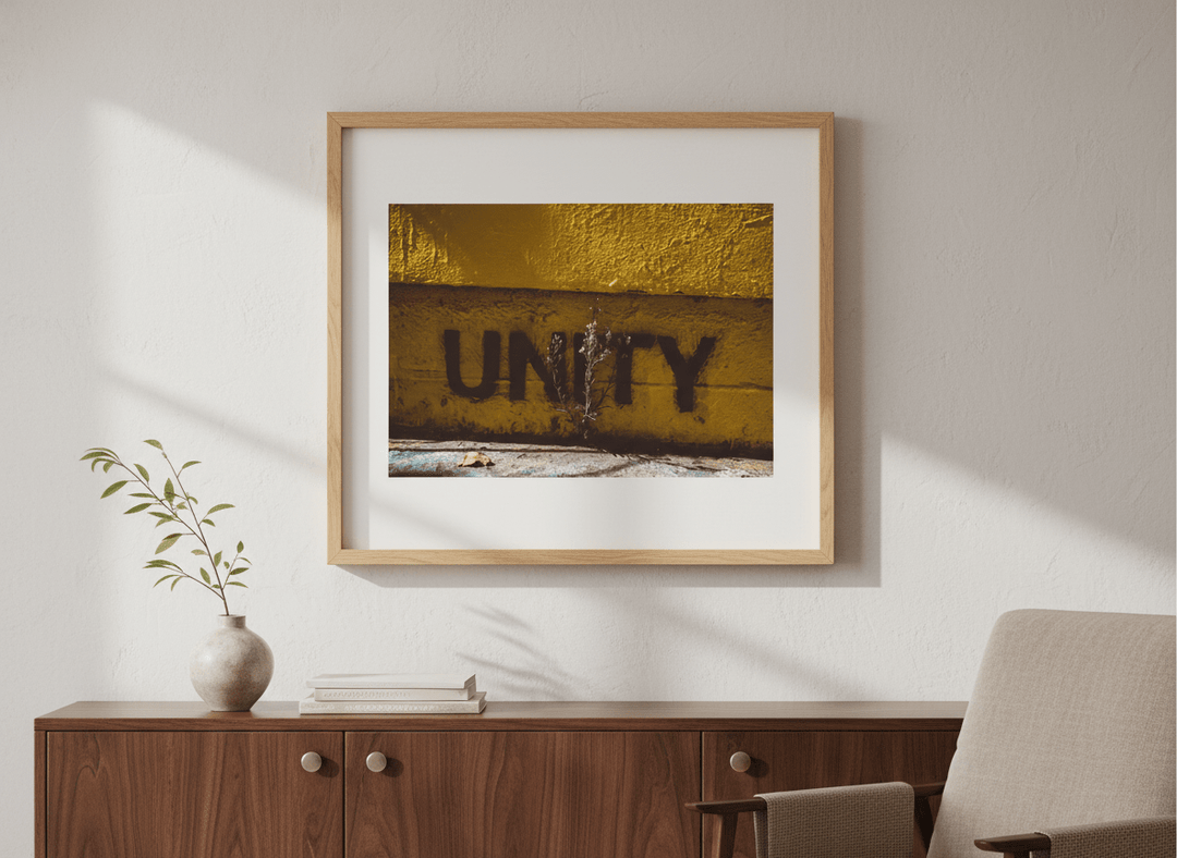 Modern wall art styled above a sofa in a neutral living room