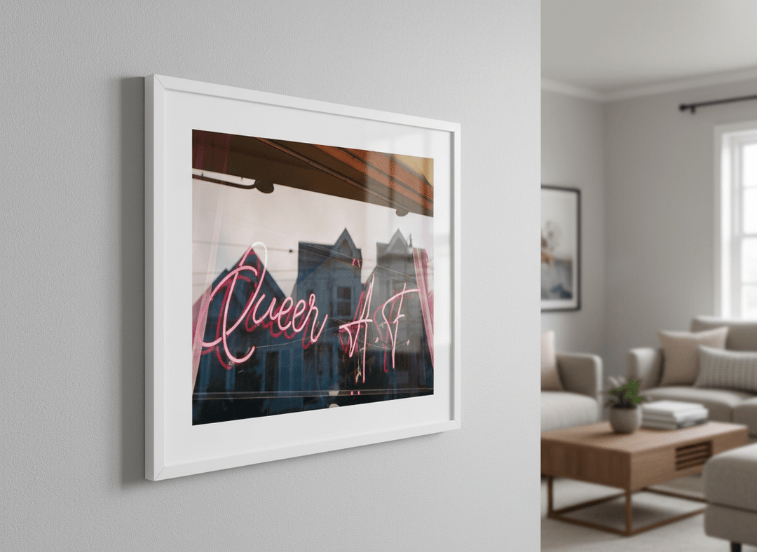 Modern wall art styled above a sofa in a neutral living room