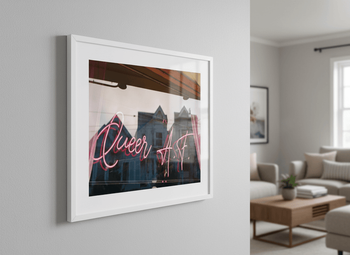 Modern wall art styled above a sofa in a neutral living room