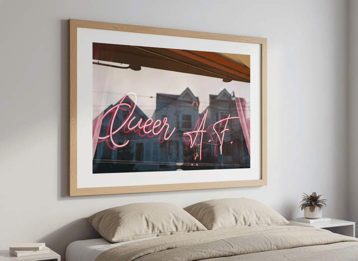 Minimalist artwork displayed in a calm, light-filled bedroom interior
