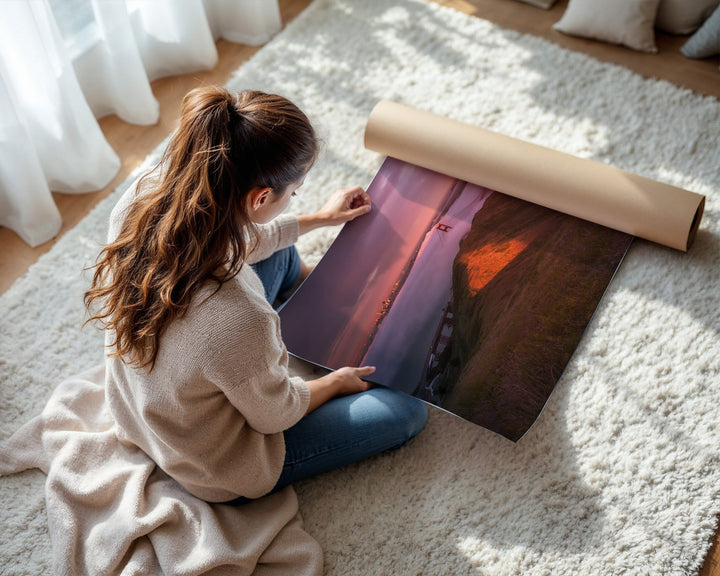 Woman unrolling a large piece of paper on a carpeted floor