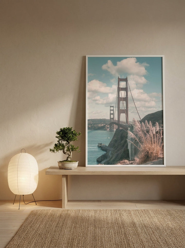Modern wall art print standing on a bench in a warm Japandi bedroom