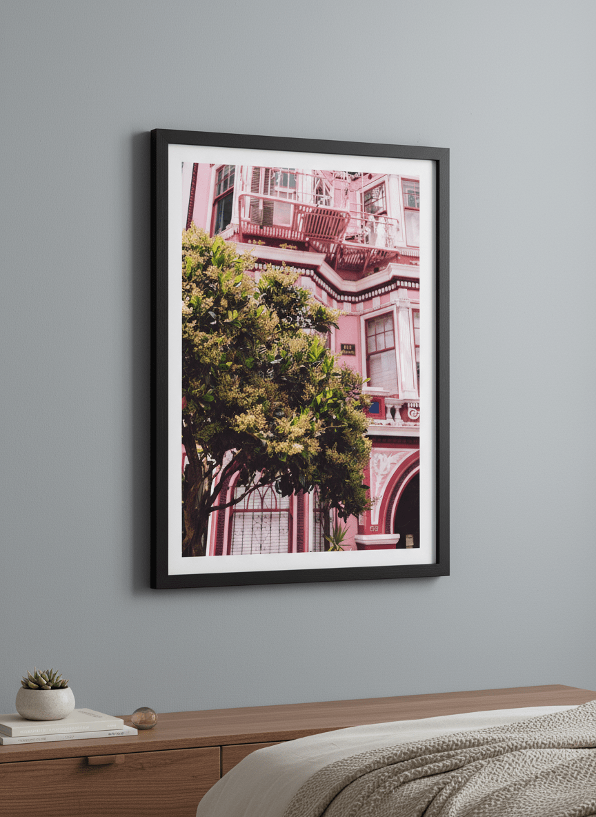 Minimalist artwork displayed in a calm, light-filled bedroom interior