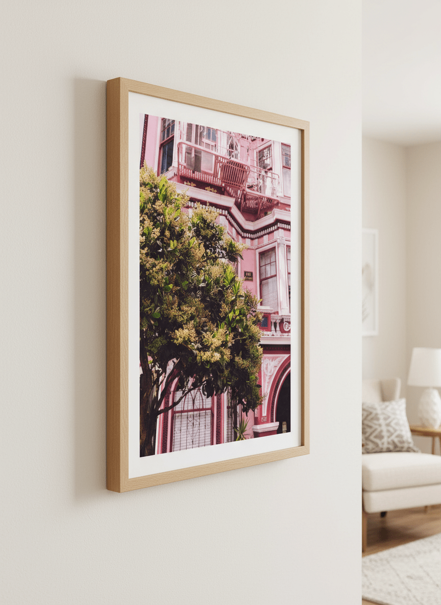 Modern wall art styled above a sofa in a neutral living room