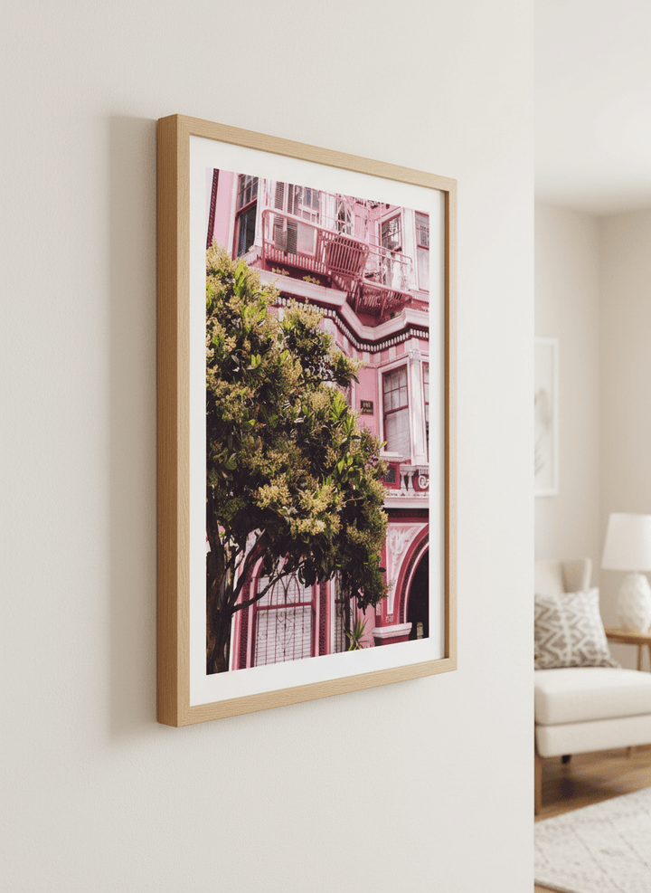 Modern wall art styled above a sofa in a neutral living room
