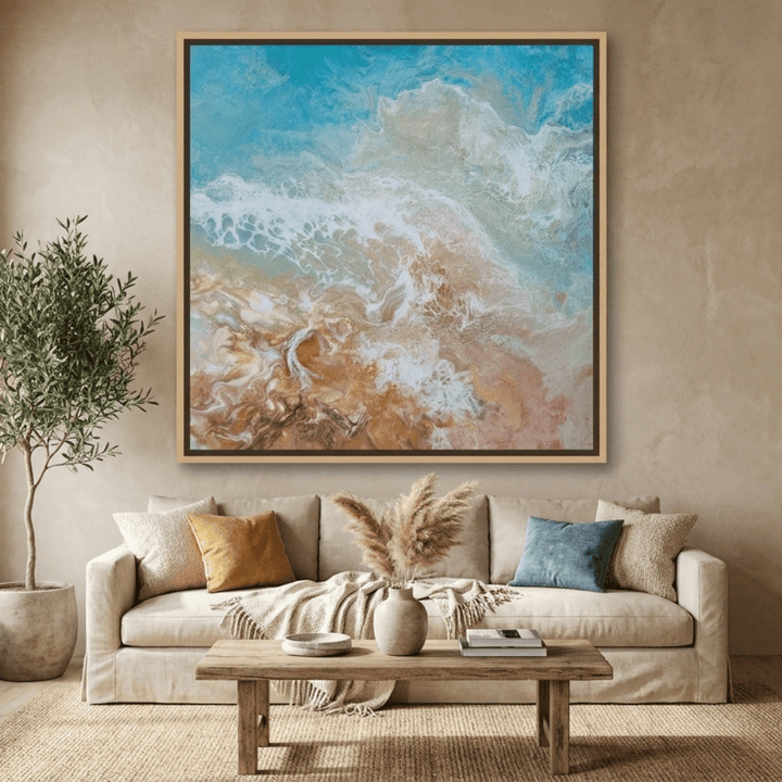 Oversized statement canvas wall art with a natural timber surround styled in a neutral living room