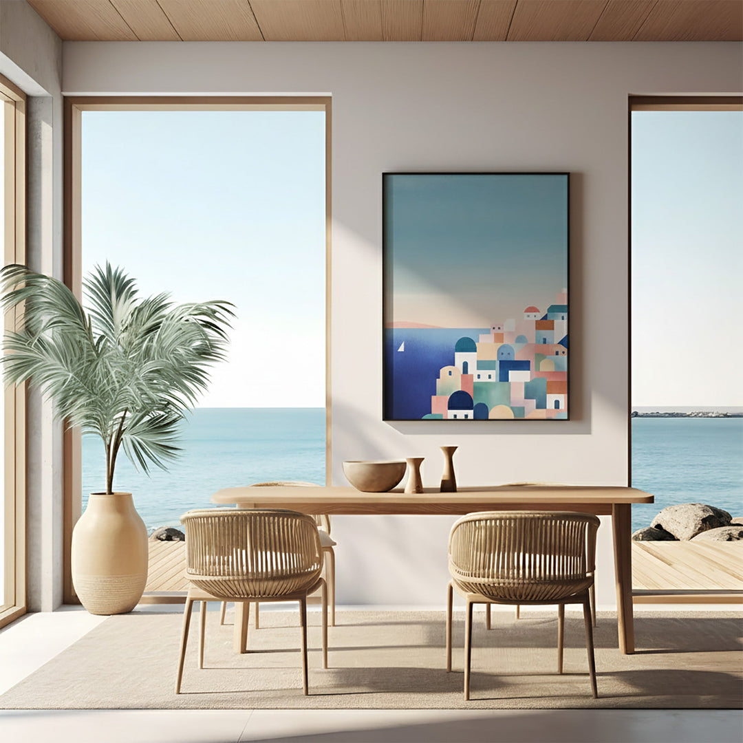 Modern dining room with a large window view of the ocean, a table, chairs, and a decorative wall art piece.