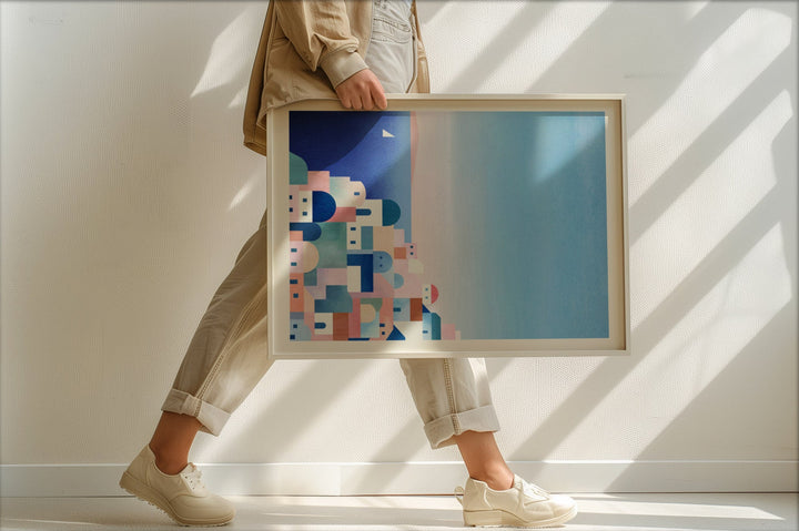 Person holding an abstract art piece with geometric shapes in a minimalistic setting