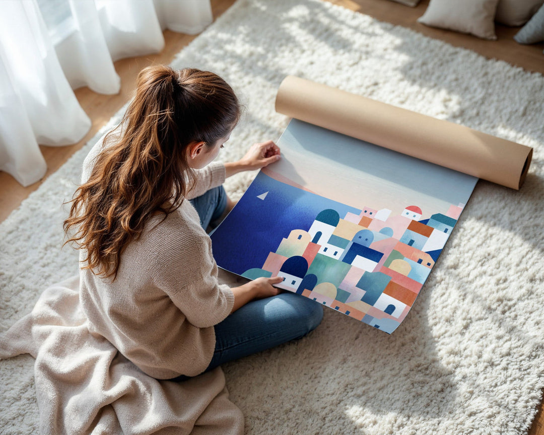Person unrolling a colorful abstract design on a floor